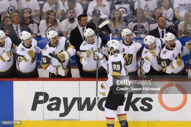 Alex Tuch of the Vegas Golden Knights celebrates with teammates after scoring a goal during the first period against the Winnipeg Jets in Game Five...