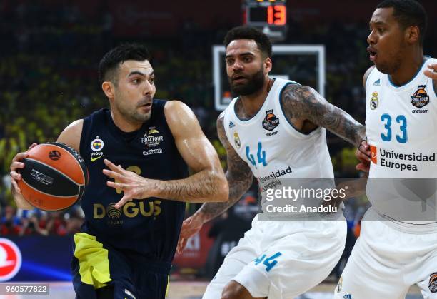 Kostas Sloukas of Fenerbahce in action against Jeffery Taylor and Trey Thompkins of Real Madrid during the Turkish Airlines EuroLeague Championship...