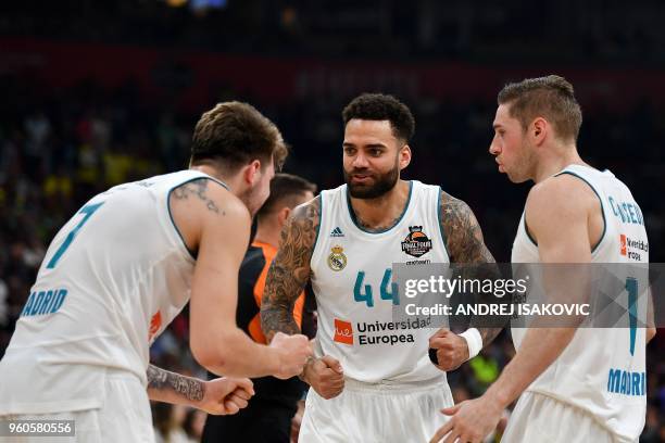 Real Madrid's Slovenian Luka Doncic Real Madrid's Swedish forward Jeffery Taylor and Real Madrid's French forward Fabien Causeur interact during the...