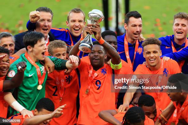 Daishawn Redan of Netherlands lifts the trophy after the UEFA European Under-17 Championship Final match between Italy and Netherlands at the Aesseal...