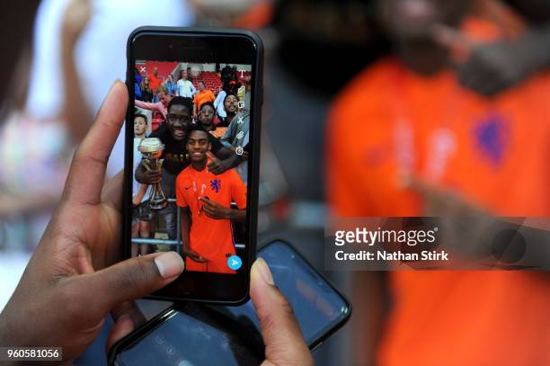 Quinten Maduro of the Netherlands celebrates with the trophy after the UEFA European Under-17 Championship Final between Italy and the Netherlands at...