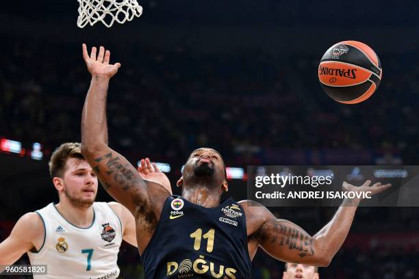 Real Madrid's Slovenian Luka Doncic looks on as Fenerbahce's US guard Brad Wanamaker looses the ball during the Euroleague Final Four finals...