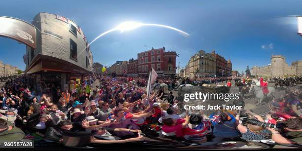 Prince Harry, Duke of Sussex and Meghan, Duchess of Sussex leave Windsor Castle in the Ascot Landau carriage during a procession after getting...