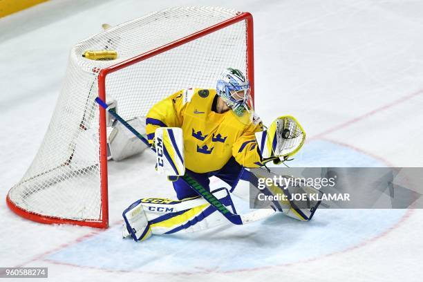 Sweden's goalkeeper Anders Nilsson make a save during the final match Sweden vs Switzerland of the 2018 IIHF Ice Hockey World Championship at the...