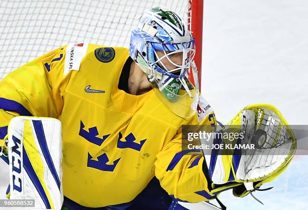 Sweden's goalkeeper Anders Nilsson make a save during the final match Sweden vs Switzerland of the 2018 IIHF Ice Hockey World Championship at the...