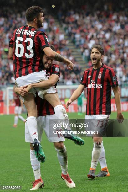 Patrick Cutrone of AC Milan celebrates his second goal with his team-mate Hakan Calhanoglu during the serie A match between AC Milan and ACF...