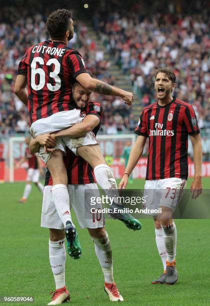 Patrick Cutrone of AC Milan celebrates his second goal with his team-mate Hakan Calhanoglu during the serie A match between AC Milan and ACF...