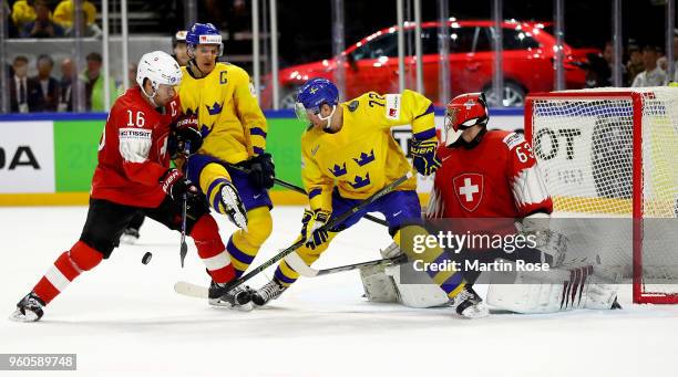 Patric Hornqvist of Sweden and Raphael Diaz of Switzerland battle for the puck during the 2018 IIHF Ice Hockey World Championship Gold Medal Game...