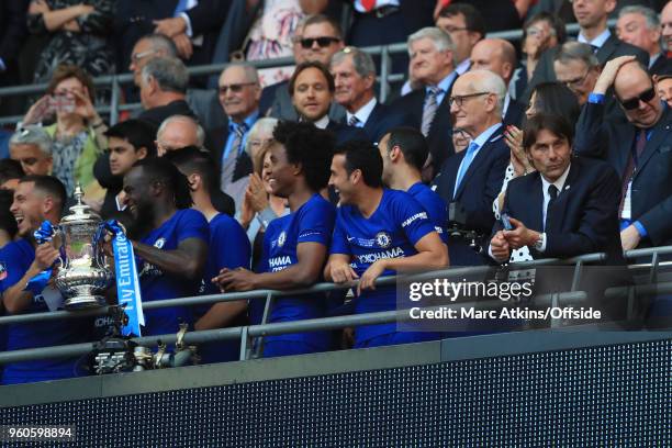 Antonio Conte manager of Chelsea looks on as his players celebrate with the trophy during The Emirates FA Cup Final between Chelsea and Manchester...