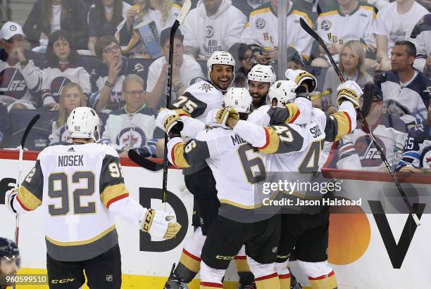 Ryan Reaves of the Vegas Golden Knights celebrates with teammates after scoring a second period goal against the Winnipeg Jets in Game Five of the...