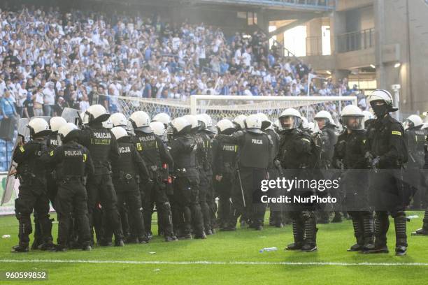 Polish police controls fans during Playoff Polish League football match between Lech Poznan and Legia Warsaw at Miejski Stadium in Poznan, Poland on...