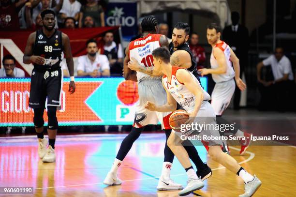 Leonardo Candi and Jalen Reynolds and Pedro Llompart of Grissin Bon competes with Pietro Aradori and Jamil Wilson of Segafredo during the LBA...