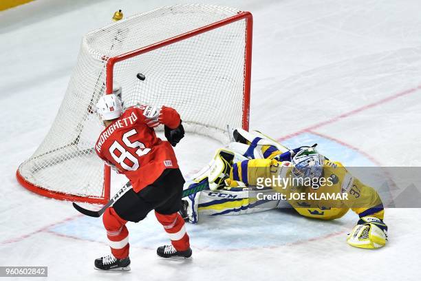 Switzerland's Sven Andrighetto scores his penalty past Sweden's goalkeeper Anders Nilsson during the final match Sweden vs Switzerland of the 2018...