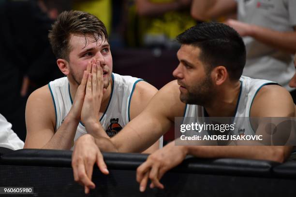 Real Madrid's Slovenian Luka Doncic looks on as a team mate keeps his fingers crossed during the final seconds of in the Euroleague Final Four finals...