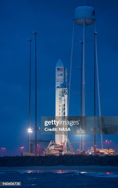 The Orbital ATK Antares rocket, with the Cygnus spacecraft onboard, is seen at launch Pad-0A, at sunrise Sunday, May 20, 2018 at Wallops Flight...