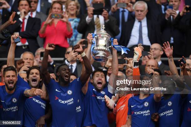 Gary Cahill of Chelsea lifts the Emirates FA Cup trophy following his sides victory in The Emirates FA Cup Final between Chelsea and Manchester...