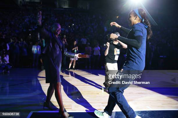 Maya Moore of the Minnesota Lynx hugs Lisa Borders as she receives her 2017 WNBA Championship ring before the season-opening home against the Los...