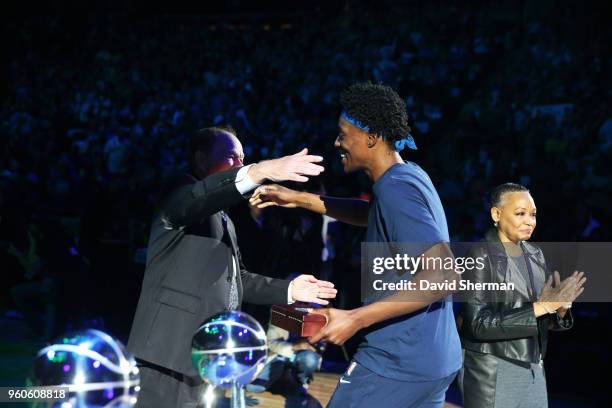 Sylvia Fowles of the Minnesota Lynx hugs Glen Taylor as she receives her 2017 WNBA Championship ring before the season-opening home against the Los...