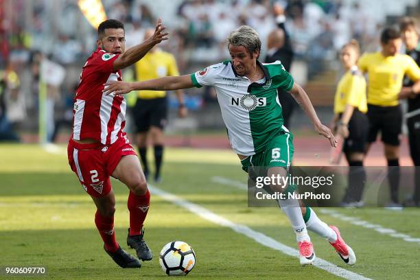 Desportivo Aves's defender Rodrigo vies for the ball with Sporting's defender Fabio Coentrao during the Portugal Cup Final football match between CD...