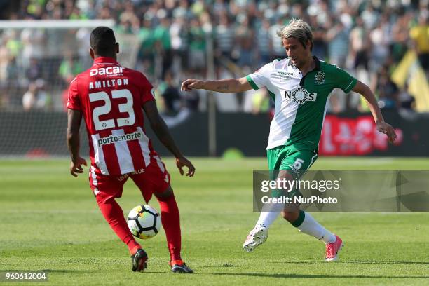 Sporting's defender Fabio Coentrao from Portugal vies with Aves' forward Amilton Silva during the Portugal Cup Final football match CD Aves vs...