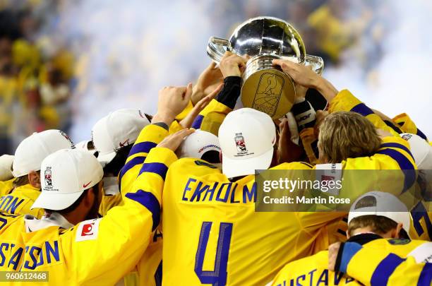 The team of Sweden celebrate winning the gold medal after the 2018 IIHF Ice Hockey World Championship Gold Medal Game game between Sweden and...