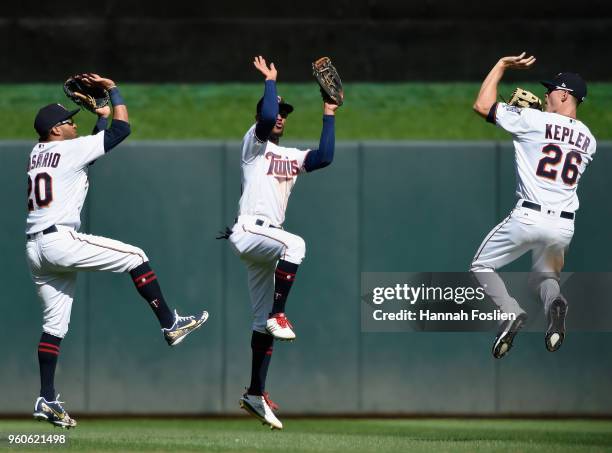 Eddie Rosario, Byron Buxton and Max Kepler of the Minnesota Twins celebrate defeating the Milwaukee Brewers 3-1 after the interleague game on May 20,...