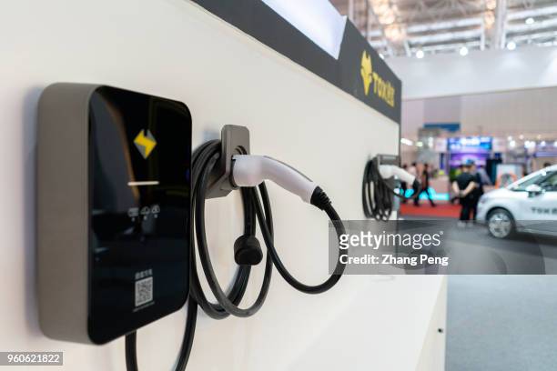 Technology company TOX shows its convenient EV charging station system on the 2nd World Intelligence Congress, which was held in Tianjin Meijiang...