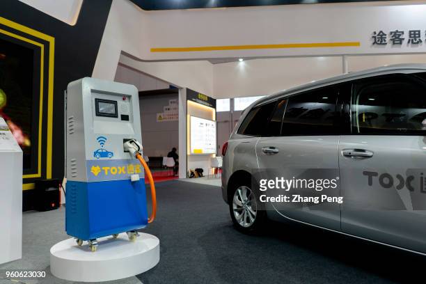 Technology company TOX shows its convenient EV charging station system on the 2nd World Intelligence Congress, which was held in Tianjin Meijiang...