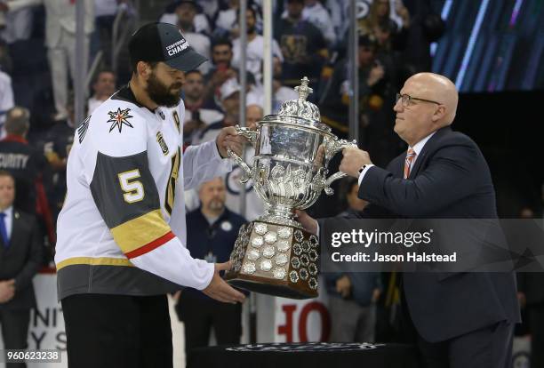 Deryk Engelland of the Vegas Golden Knights is presented with the Clarence S. Campbell Bowl after defeating the Winnipeg Jets 2-1 in Game Five of the...