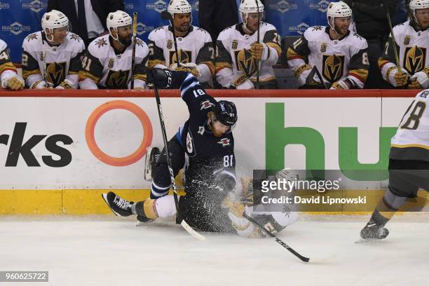 Kyle Connor of the Winnipeg Jets and Erik Haula of the Vegas Golden Knights battle on the ice during the third period in Game Five of the Western...