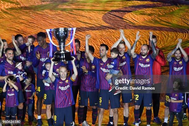 Barcelona players celebrate with La Liga trophy at the end of the La Liga match between Barcelona and Real Sociedad at Camp Nou on May 20, 2018 in...