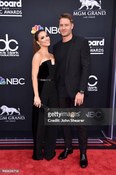 Actors Chrishell Stause and Justin Hartley attend the 2018 Billboard Music Awards at MGM Grand Garden Arena on May 20, 2018 in Las Vegas, Nevada.