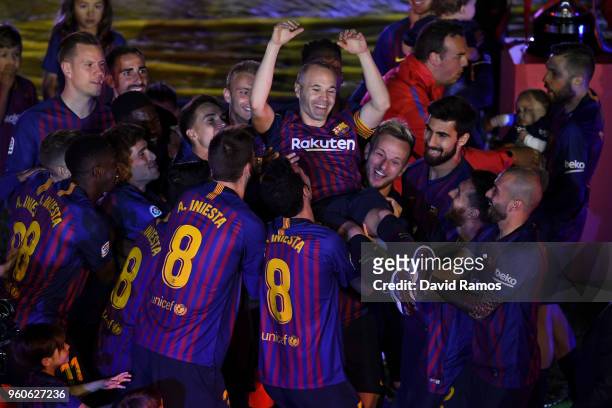 Andres Iniesta of FC Barcelona is tossed into the air by his team mates at the end of the La Liga match between Barcelona and Real Sociedad at Camp...