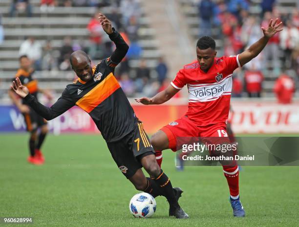 DaMarcus Beasley of Houston Dynamo and Mo Adams of Chicago Fire battle for the ball at Toyota Park on May 20, 2018 in Bridgeview, Illinois. The...