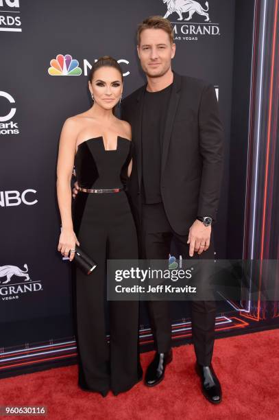 Actor Justin Hartley and Chrishell Stause attend the 2018 Billboard Music Awards at MGM Grand Garden Arena on May 20, 2018 in Las Vegas, Nevada.