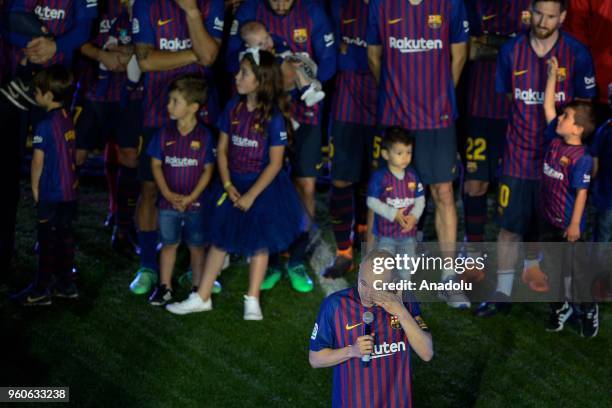 Barcelona's midfielder Andres Iniesta cries as he speaks during the ceremony at the end of the Spanish league football match between FC Barcelona and...