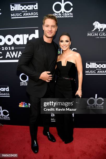 Actors Justin Hartley and Chrishell Stause attend the 2018 Billboard Music Awards at MGM Grand Garden Arena on May 20, 2018 in Las Vegas, Nevada.