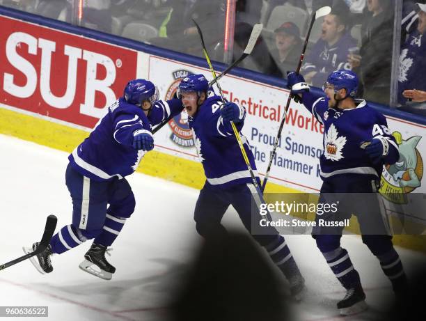 Toronto Marlies center Miro Aaltonen celebrates after scoring the overtime winner with Toronto Marlies left wing Andreas Johnsson and Calle Rosen as...