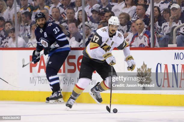 Luca Sbisa of the Vegas Golden Knights skates with the puck during the third period against the Winnipeg Jets in Game Five of the Western Conference...