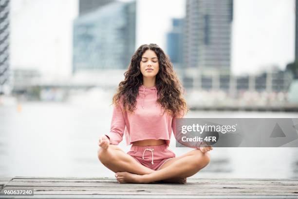 yoga, meditation, pensive, city life - woman breathe stock pictures, royalty-free photos & images