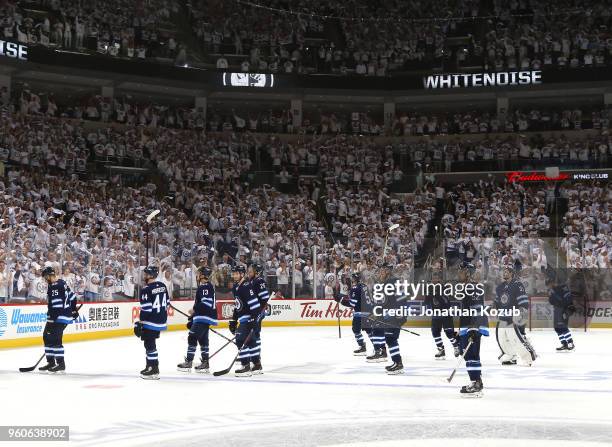 Winnipeg Jets players salute the fans as they leave the ice following a 2-1 loss against the Vegas Golden Knights in Game Five of the Western...
