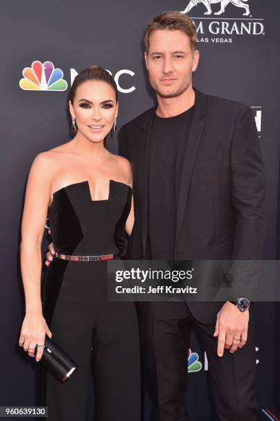 Actor Justin Hartley and Chrishell Stause attend the 2018 Billboard Music Awards at MGM Grand Garden Arena on May 20, 2018 in Las Vegas, Nevada.