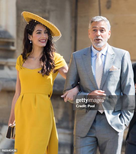 George Clooney and Amal Clooney attend the wedding of Prince Harry to Ms Meghan Markle at St George's Chapel, Windsor Castle on May 19, 2018 in...