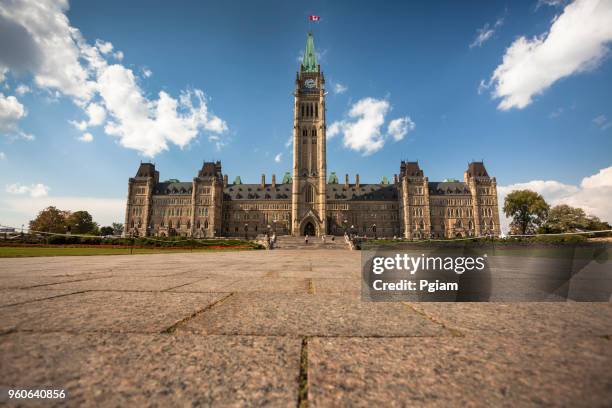 parliament building and peace tower in ottawa,canada - canada government stock pictures, royalty-free photos & images