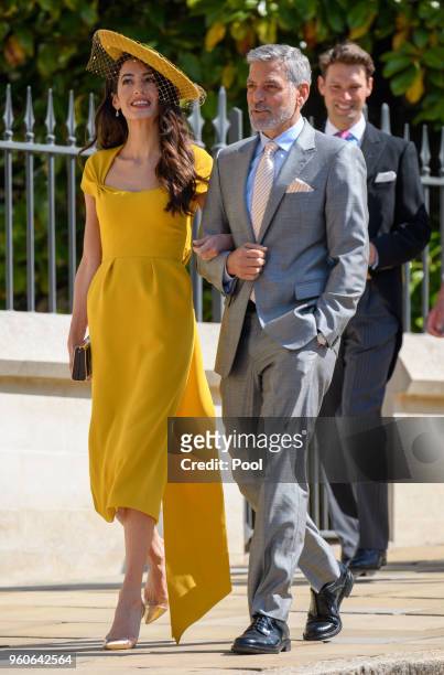 George Clooney and Amal Clooney attend the wedding of Prince Harry to Ms Meghan Markle at St George's Chapel, Windsor Castle on May 19, 2018 in...
