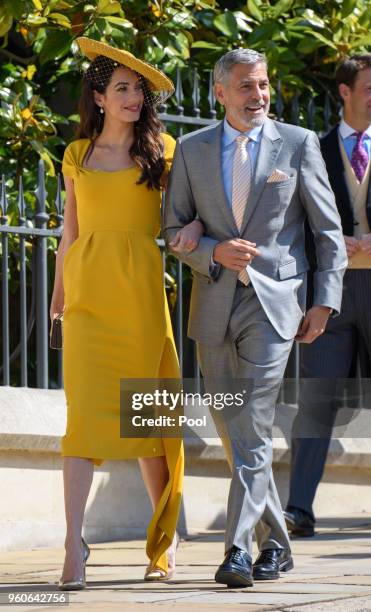 George Clooney and Amal Clooney attend the wedding of Prince Harry to Ms Meghan Markle at St George's Chapel, Windsor Castle on May 19, 2018 in...