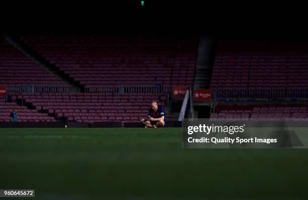 Andres Iniesta of FC Barcelona sits on the pitch at the end the La Liga match between Barcelona and Real Sociedad at Camp Nou on May 20, 2018 in...