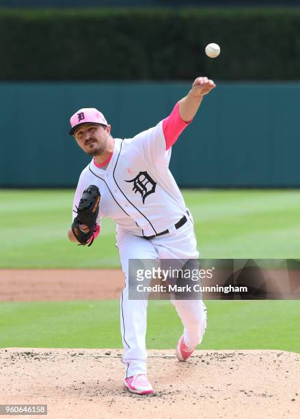 Blaine Hardy of the Detroit Tigers throws a warm-up pitch while wearing a pink hat and shirt to honor Mother's Day during the game against the...