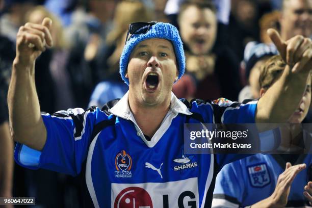 Sharks fan cheers his side during the round 11 NRL match between the Cronulla Sharks and the Canterbury Bulldogs at Southern Cross Group Stadium on...