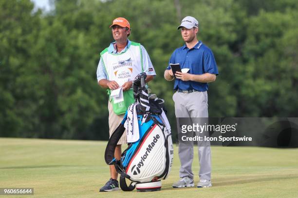 Tyler Duncan and his caddy check their notes on the 18th fairway during the final round of the AT&T Byron Nelson on May 20, 2018 at Trinity Forest...